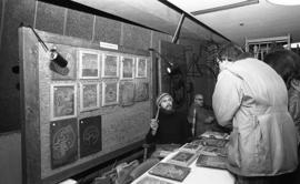 Photograph of a stand selling artwork at a craft market