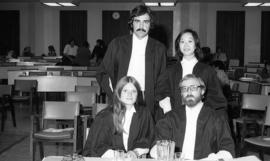 Photograph of four law students at an award presentation