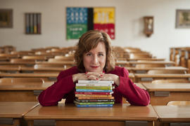 Publicity photograph of Jessica Kerrin in a classroom with her books