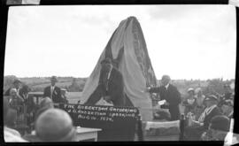 Photograph of Mr. J.G. Robertson speaking at the unveiling of the Cairn at the Robertson Gathering