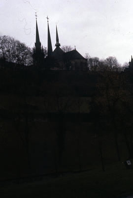 Photograph of a hillside with an unidentified church at the top