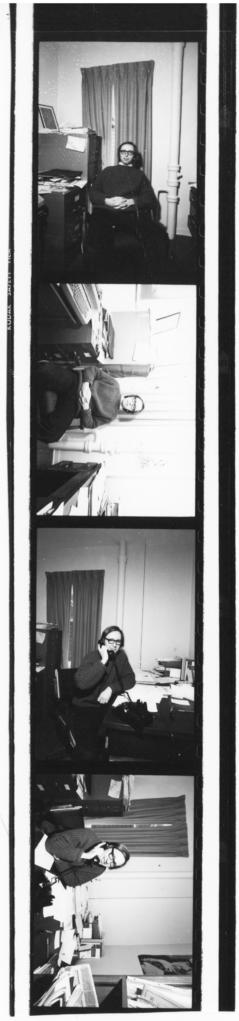 Contact sheet of photographs of unidentified man in an office