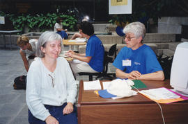 Photograph of Elaine Boychuk demonstrating the Libraries' electronic services and products to Viv...