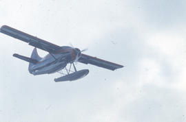 Photograph of an RCMP airplane in flight