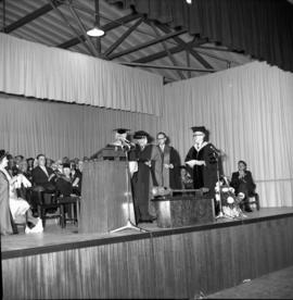 Photograph of an unidentified person receiving an honorary degree