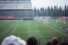 Photograph of a soccer match featuring Iran versus Cuba