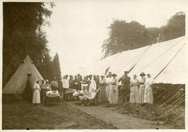 In the Sunshine at Argues, a convoy of German Prisoners with the tent hospital