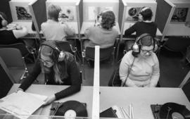 Photograph of a students listening to records and tapes
