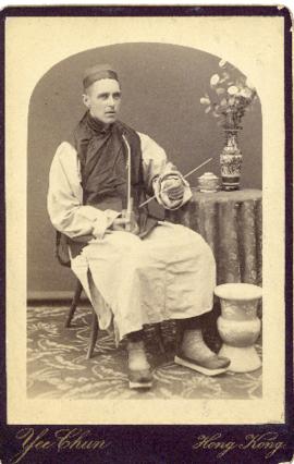 Portrait of Corporal T.H. Raddall, Sr. of the Royal Marine Light Infantry, in Chinese costume wit...