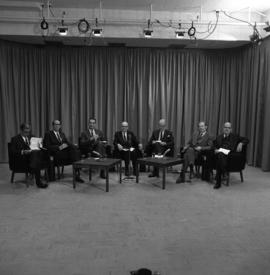 Photograph of a panel of seven unidentified people