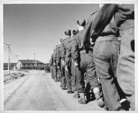 Photograph of Tracadie Camp soldiers marching to church near the camp headquarters, 1943