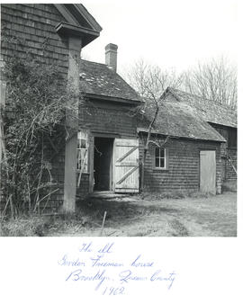 Photograph of the chimney and rear door to the Gordon Freeman house in Brooklyn, Queens County