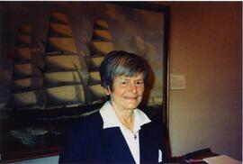Photograph of Elisabeth Mann Borgese in front of a painting