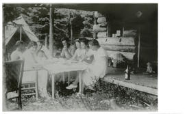 Photograph of Edith and Thomas Head Raddall eating with friends at Geetpoo Lodge, Eagle Lake