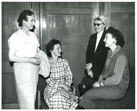 Photograph of four people at miscellaneous unknown health-related event