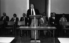 Photograph of an unidentified person speaking at the law school opening