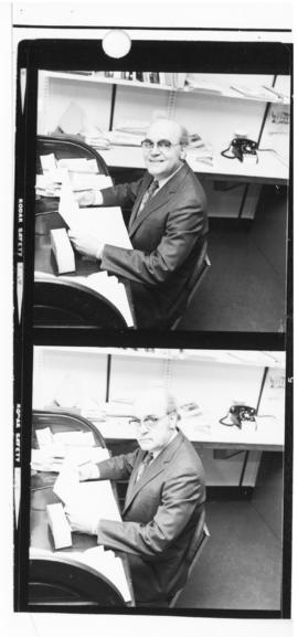 Contact sheet of photographs of unidentified man in an office
