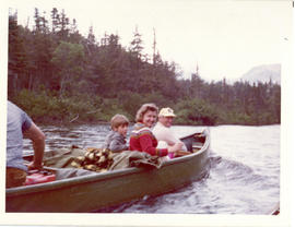 Photograph of Mik(e) and Eleanor Green and their sons in a canoe on the Serpentine River in Newfo...
