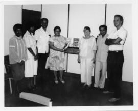 Photograph of Elisabeth Mann Borgese, library staff, Krishan Saigal and Dr. Trevor Jackson
