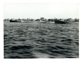 Photograph of four fishing boats aligned in the water near Cape Sable Island