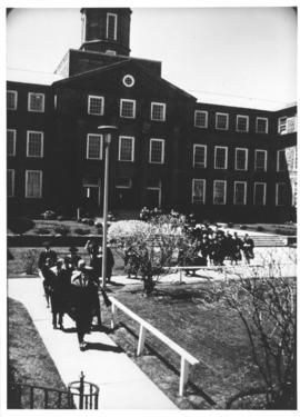 Photograph of a convocation procession in front of the Arts & Administration Building