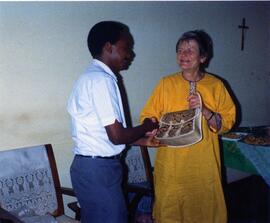 Photograph of Elisabeth Mann Borgese receiving a handbag