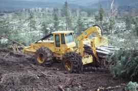 Photograph of forestry equipment grapple-skidding whole trees at a clearcut site near Corner Broo...