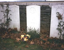 Photograph of flowers laid at Lieutenant Colonel T.H. Raddall, Sr.'s grave in the Manitoba Cemete...