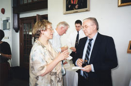 Photograph of Betty Sutherland and an unidentified man at Patricia Lutley's retirement party