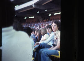Photograph of two people, David and Bill, sitting in the stadium