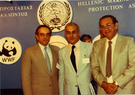 Photograph of three men at a Hellenic Marine Environment Protection Association (HELMEPA) event