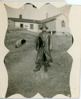 Photograph of a person standing in front of the Sable Island wireless station after construction ...