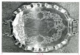 Photograph of an engraved silver plate presented to Thomas Head Raddall by the Mersey Paper Co.
