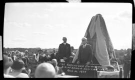 Photograph of Mr. Donald A. MacKenzie reciting the poem "The Pioneer" at the unveiling of the Cai...