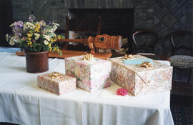 Photograph of gifts on a table at Patricia Lutley's retirement party at University Hall