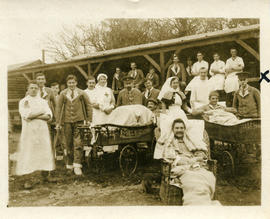 Group shot of patients, doctors and nursing sisters outside