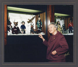Photograph of Dixie Pelluet with marionettes