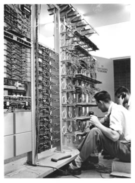 Photograph of telephones being installed in the Arts and Administration building