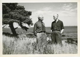Photograph of Thomas Head Raddall standing with Turnbull near the coast of Moose Harbour