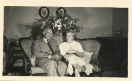 Photograph of Thomas Head and Edith Raddall sitting together at a celebration of their silver (25...