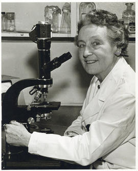 Photograph of Dixie Pelluet with microscope