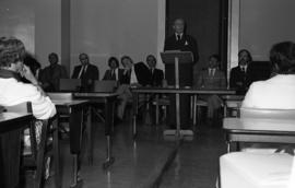 Photograph of an unidentified person speaking at the law school opening
