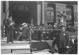 Photograph of an unidentified person speaking on the front steps on Halifax city hall