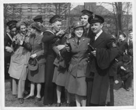 Photograph of Royal Canadian Navy sailors and officers and members of the Canadian Women's Army C...