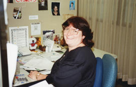 Photograph of Darlene Hazel working at the Killam Memorial Library