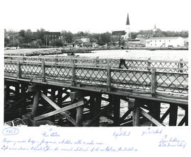 Photograph of a man walking along a temporary wooden bridge along the waterfront in Liverpool, No...