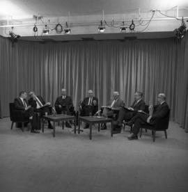 Photograph of a panel of seven unidentified people