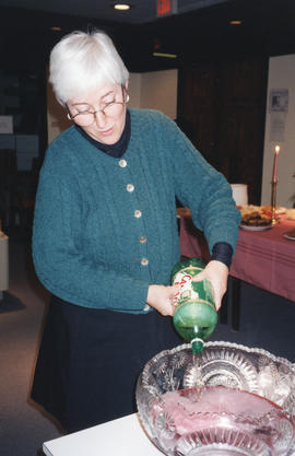 Photograph of Bonnie Best Flemming making punch in the Killam Memorial Library staff lounge