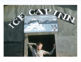 Photograph of Barbara Hinds standing in the doorway of the Ice Cap Inn