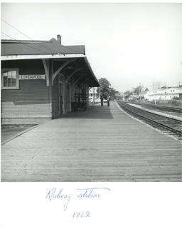 Photograph of the rails and two men talking on the platform at the railway station in Liverpool, ...